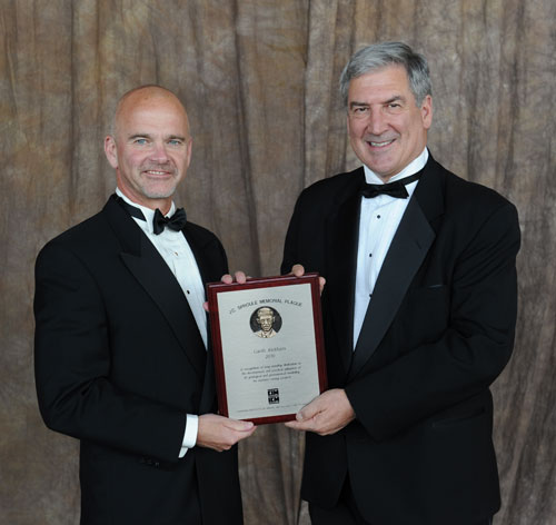 Director Garth Kirkham P.Geo., P.Geoph. (left) on being awarded the Canadian Institute of Mining’s 2010 JC Sproule Memorial Plaque